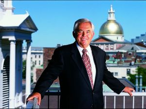 Suffolk University President David J. Sargent (1989-2010) with dome of Massachusetts State House in background