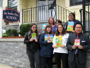 The UML French Club book donation to Ste Jeanne d'Arc Elementary School
