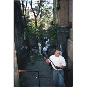 Volunteers cleaning up the area around the Jorge Hernandez Cultural Center.