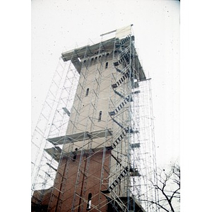 The tower of the former Shawmut Congregational Church wrapped in scaffolding during the construction of Taino Tower.