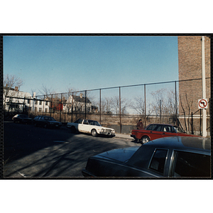 An empty lot behind a fence at the Boys and Girls Club Roxbury Clubhouse at 80 Dudley Street