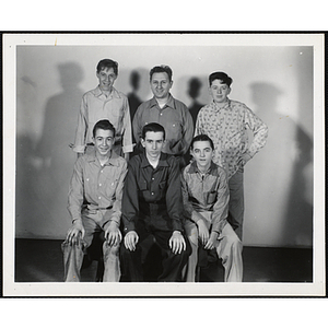 A man and five Boys' Club members pose for a group picture