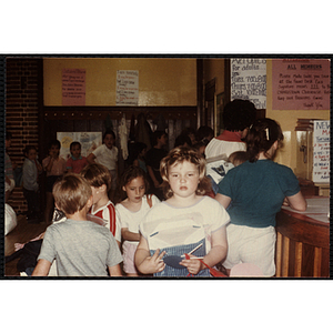 A Girl carrying her new shirt during an open house