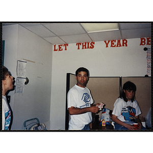 A man and a girl pose for a shot during an End of Year Party