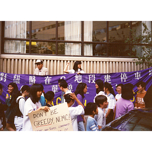 Chinese children and adults hold a summer rally on Washington Street protesting the New England Medical Center's plan to build a parking garage on Parcel C (Oak Street parking lot in Chinatown)