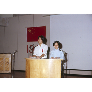 Speakers at an anniversary celebration of the People's Republic of China, held in the Josiah Quincy School auditorium