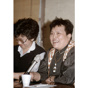 Suzanne Lee sits with another female member of the Chinese Progressive Association at an unidentified CPA event