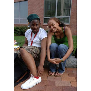 Ulysses Ifill and Melanie Arvajo sit together during a scavenger hunt