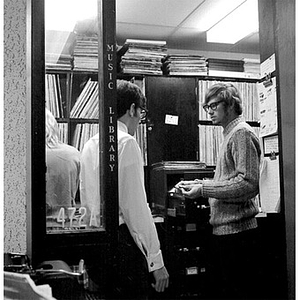 Three people working in the WNEU studio