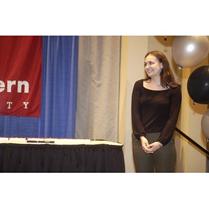 A young woman on stage at the Student Activities Banquet