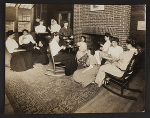 Women sitting around the fireplace, Magnolia, Gloucester, Mass., undated