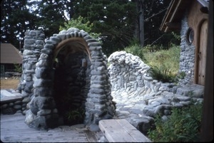 Stone shower, with stone wave behind and to the right at Big Flat House