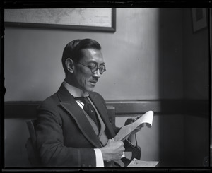 Tehyi Hsieh, the "Teddy Roosevelt of China": portrait seated, reading