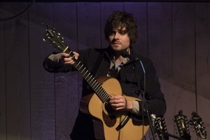 Matt Nakoa (acoustic guitar) performing in concert at the Payomet Performing Arts Center