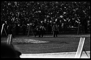 Beatles concert at Shea Stadium: Beatles walking toward the stage with crowd in background: George Harrison, John Lennon, Paul McCartney, and Ringo Starr (l. to r.)