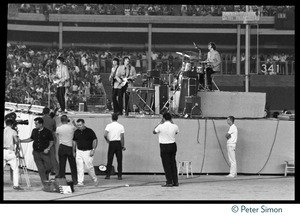 The Beatles performing on stage, Shea Stadium concert