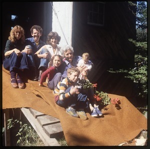 Keller family posed by the entrance to the barn, Wendell Farm Commune