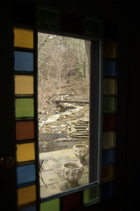 Sheffield House: view through a colored glass window in the home of Martin Canellakis and Faith Cromas, Sheffield, Mass.