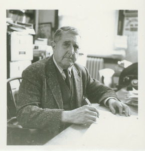 Arthur I. Bourne sitting at a desk