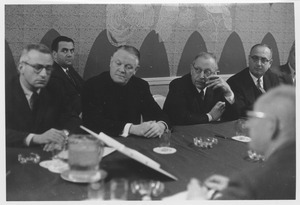 Robert D. Gordon, Gerald J. Grady, Christopher J. Weldon, Dr. Harry C. Solomon, and two unidentified men sitting at a conference room table