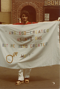 Sylvia Rivera holding banner at Christopher Street Liberation Day parade, 1983