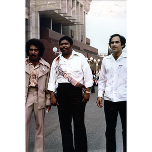 Three men standing outside Boston City Hall