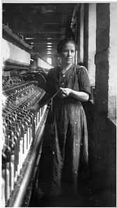Two female textile workers at a spinning frame. [06]