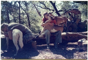 Sandi Sommer and her brother Wayne hugging animals