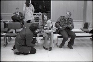 Richard Safft talking with family in waiting area at JFK airport