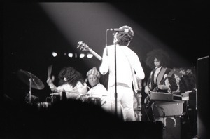 Santana concert at the Springfield Civic Center: Carlos Santana (back to camera) playing guiter to band