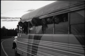 Free Spirit Press crew peering out bus windows