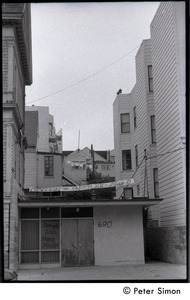 View of a building hung with a banner reading 'Revival -- April 28-May 5'