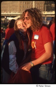 MUSE concert and rally: MUSE staff member laughing with a woman