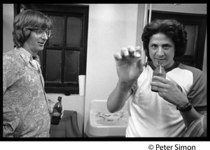 Phil Lesh with unidentified man holding a bottle cap