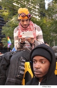Occupy Wall Street: two demonstrators, one playing on a Nintendo DS
