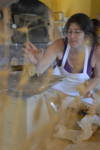 Hungry Ghost Bread: owner and baker Cheryl Maffei weighing cookie dough