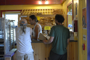 Hungry Ghost Bread: owner and baker Jonathan C. Stevens serving customers at the counter