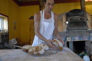 Hungry Ghost Bread: owner and baker Jonathan C. Stevens with fresh-baked bread