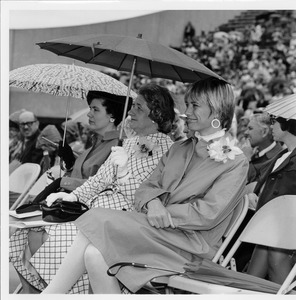 Three women sitting at Commencement