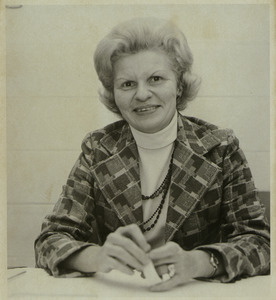 Ann Broga sitting at table