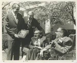 Richard M. Nixon, accompanied by Harold Russell, presents the 1970 President's Trophy to Richard and Robert Santin