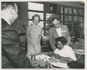 Attendees observe an ICD client at work at the 1959 Rehabilitation Counselors Conference