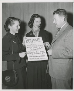 Willis C. Gorthy and two unidentified women with poster for opera benefit