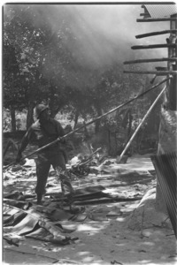 1st Infantry men destroying houses in Vietcong held area; Hau Nghia.