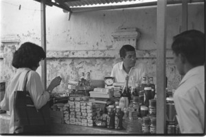 Street vendors selling black market and stolen goods; Saigon.