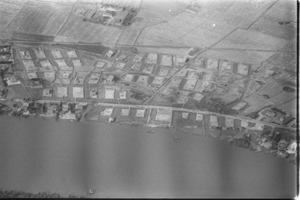 Aerials of the Mekong Delta. Shows country road sabotaged by guerrillas, and also some hamlets occupied by guerrillas.
