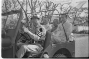 Buddhist chaplains riding Vietnamese army jeep.