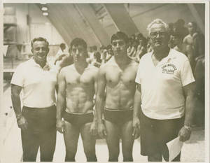 Coaches Charlie Smith and Charles Silvia with SC swimmers David Roach and Bill Vogler