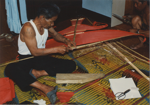 Kite Making: Tim Sao fits the Aik onto the top of the kite's spine, 1987