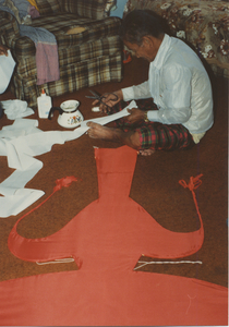 Kite Making: Tim Sao cuts the long tail part of the kite, 1987